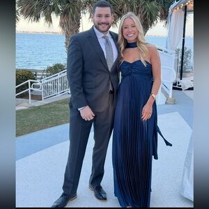 Navy pleated dress with neck scarf